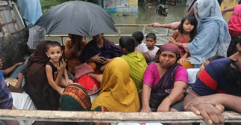 ‘হু হু করে ঘরে ঢুকেছে পানি, কয়েকটা কাপড় নিয়ে বেরিয়ে আসি’