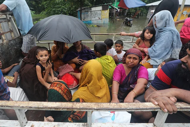 ‘হু হু করে ঘরে ঢুকেছে পানি, কয়েকটা কাপড় নিয়ে বেরিয়ে আসি’